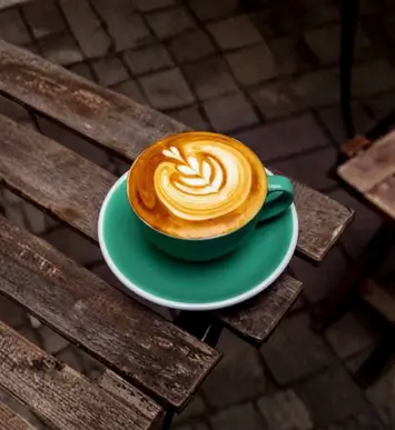 Latte coffee served in a white cup